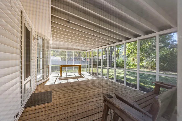 a view of a patio with wooden floor