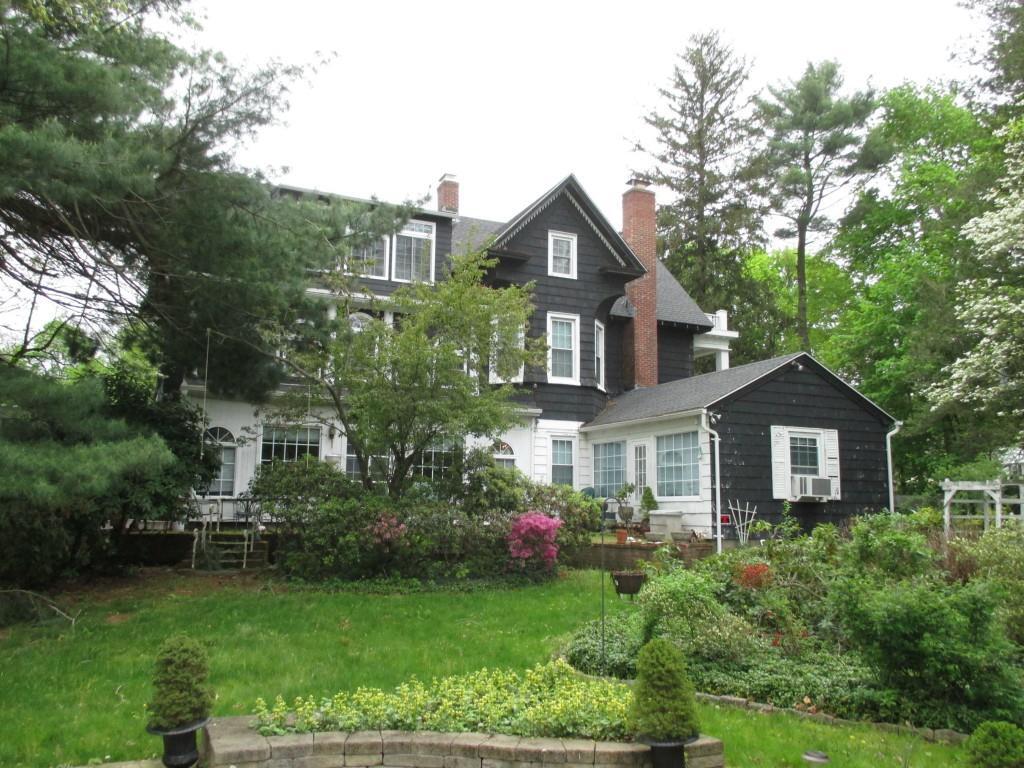 887 Hanover Road Meriden, CT 06451 - Photo 1 of 1 a front view of a house with garden