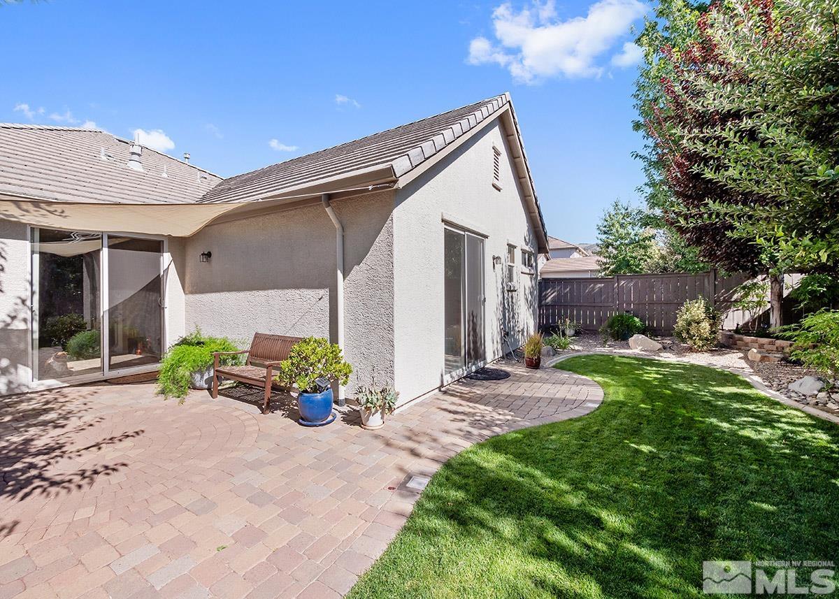 13735 Seabiscuit Drive Reno, NV 89521 - Photo 19 of 24 a view of a chair and table in backyard of the house