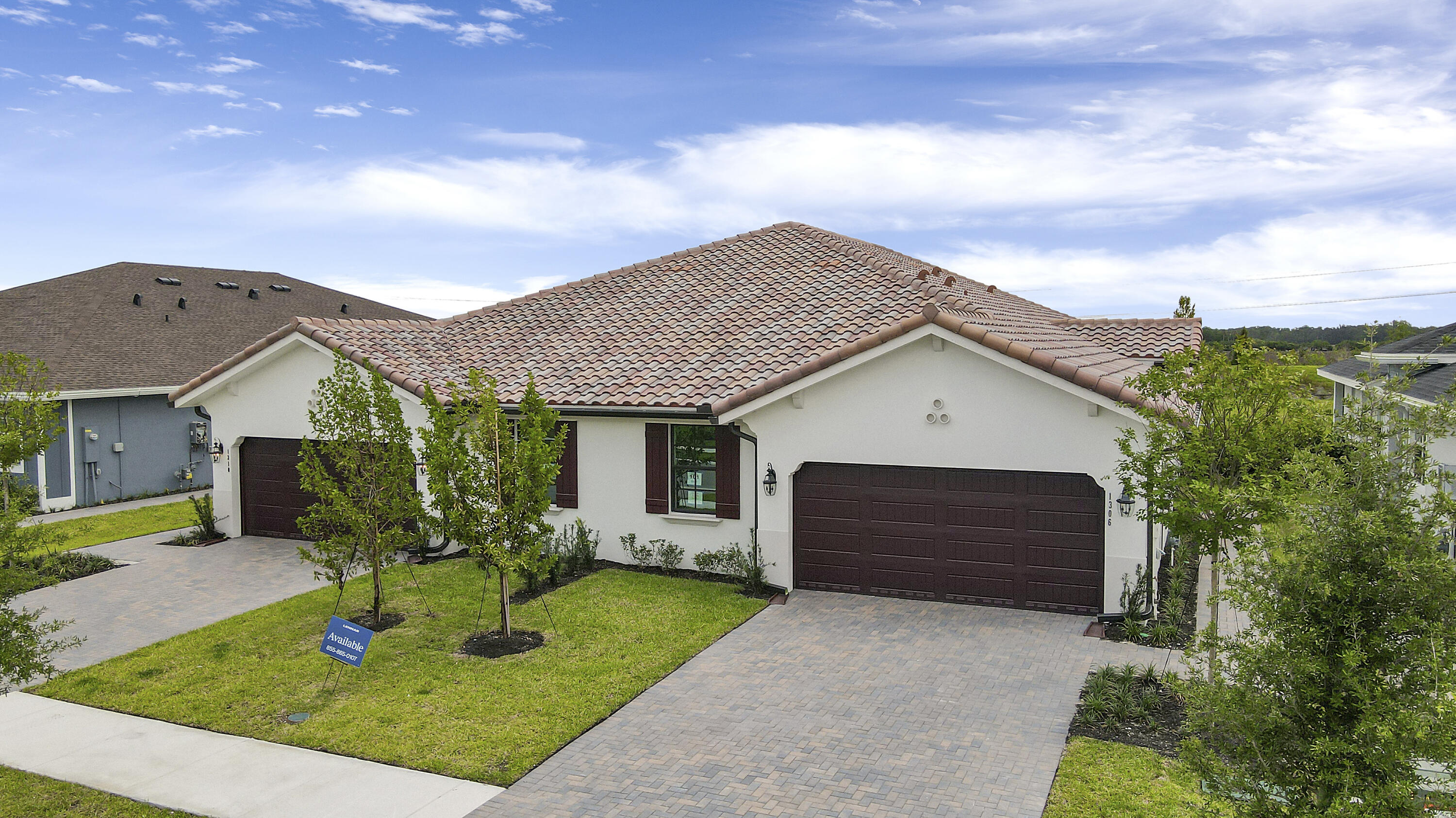 a front view of a house with a yard