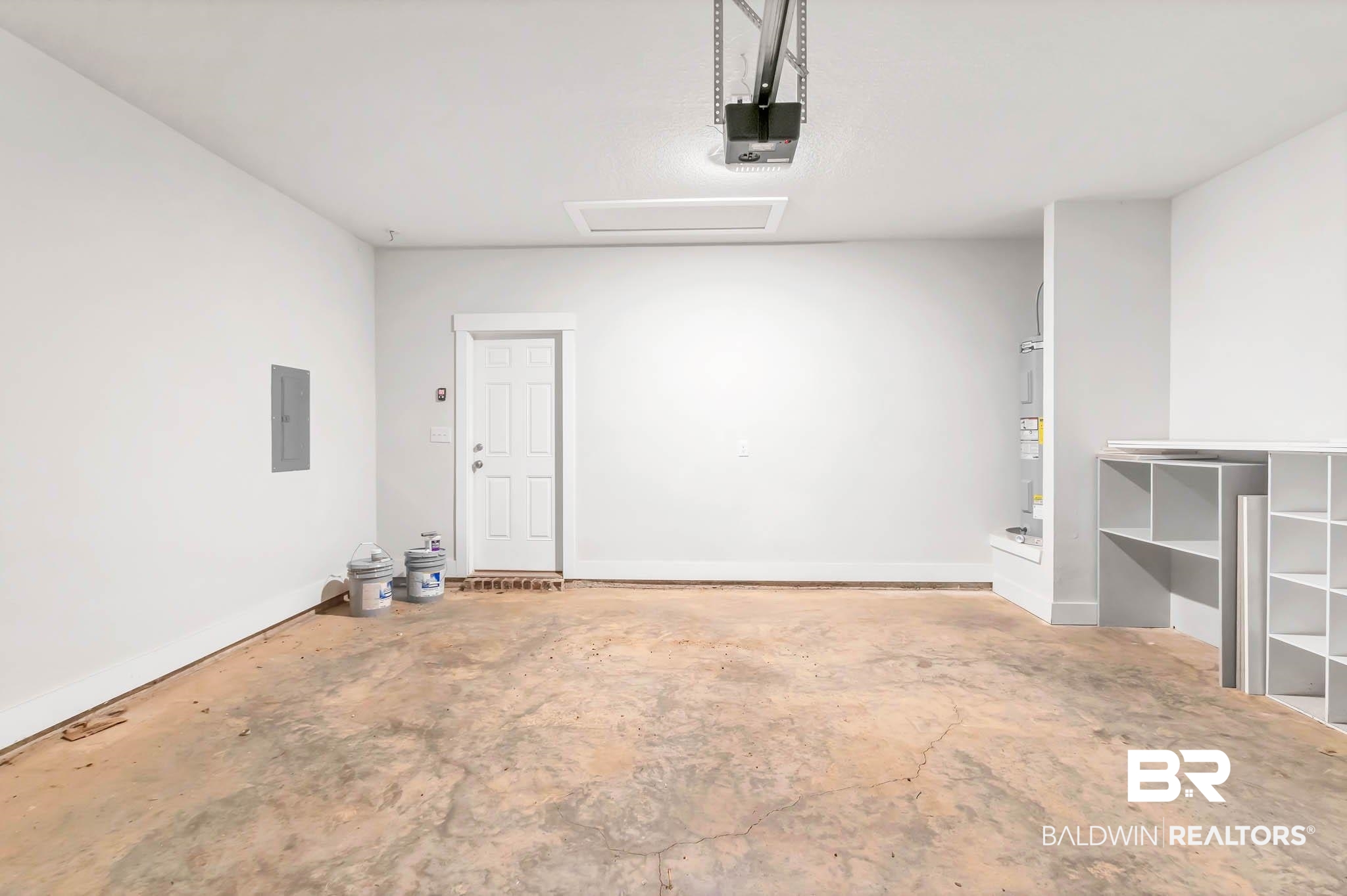 16461 Prado Loop Loxley, AL 36551 - Photo 54 of 78 Garage featuring electric panel, a garage door opener, and electric water heater