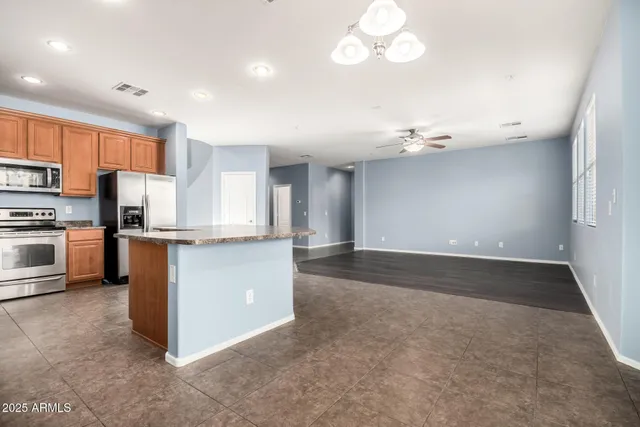a view of a kitchen with a sink and a window