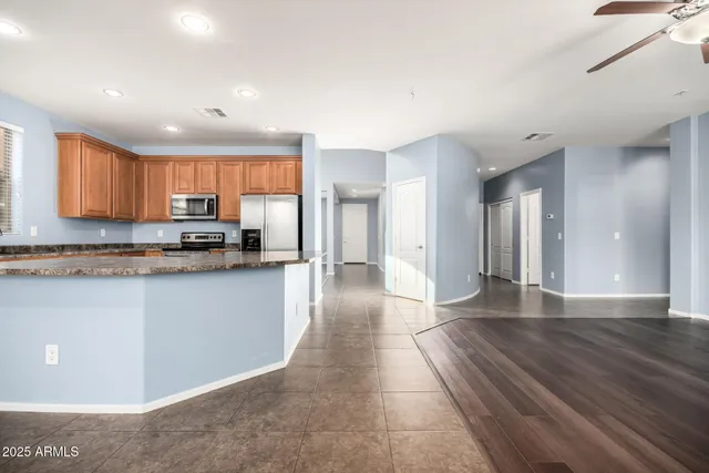 a kitchen with granite countertop a sink and a stove