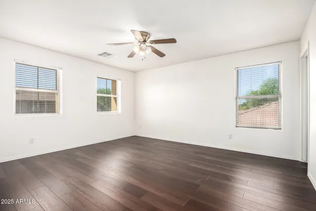 a bathroom with a double vanity sink and mirror