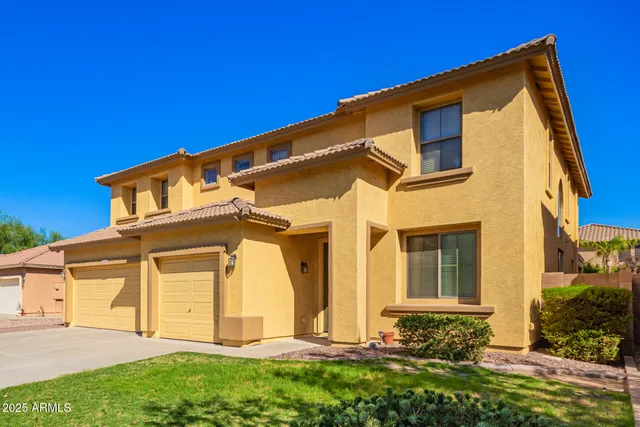 front view of a house with a small yard