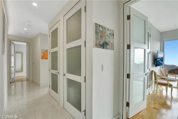 a view of a hallway with dining area