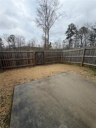 a view of outdoor space with wooden fence