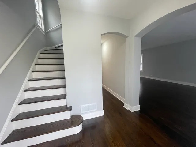 a view of entryway with wooden floor