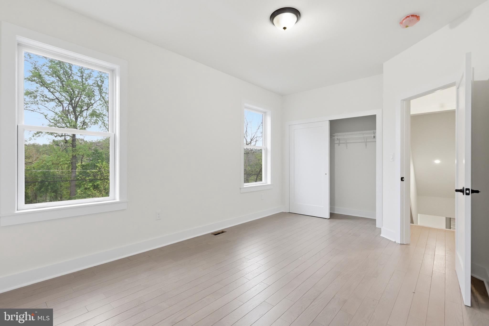 759 River Road Erwinna, PA 18920 - Photo 25 of 46 a view of an empty room with wooden floor and a window