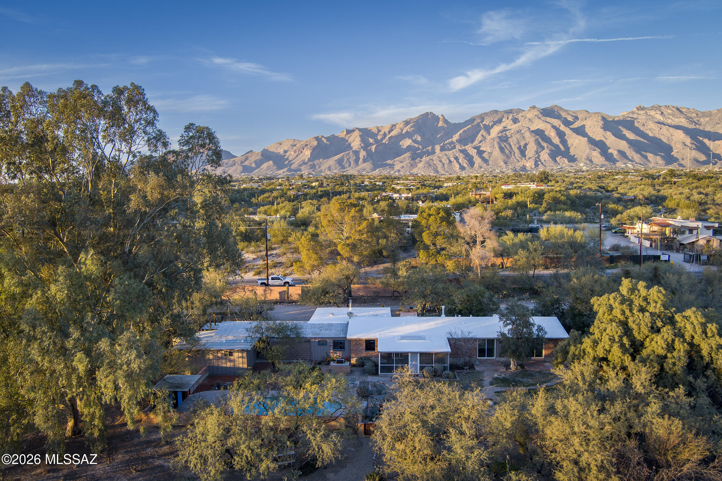 4130 East River Road Tucson, AZ 85718 - Photo 2 of 46 a view of a city with lots of trees