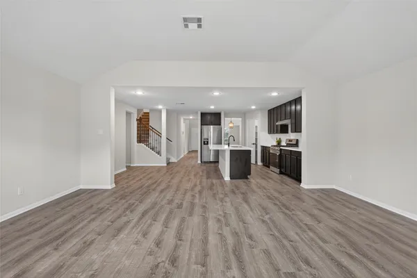 a view of kitchen with wooden floor
