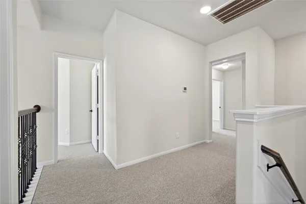 a bedroom with bed and window