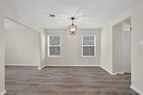 a view of livingroom with window ceiling fan and hardwood floor