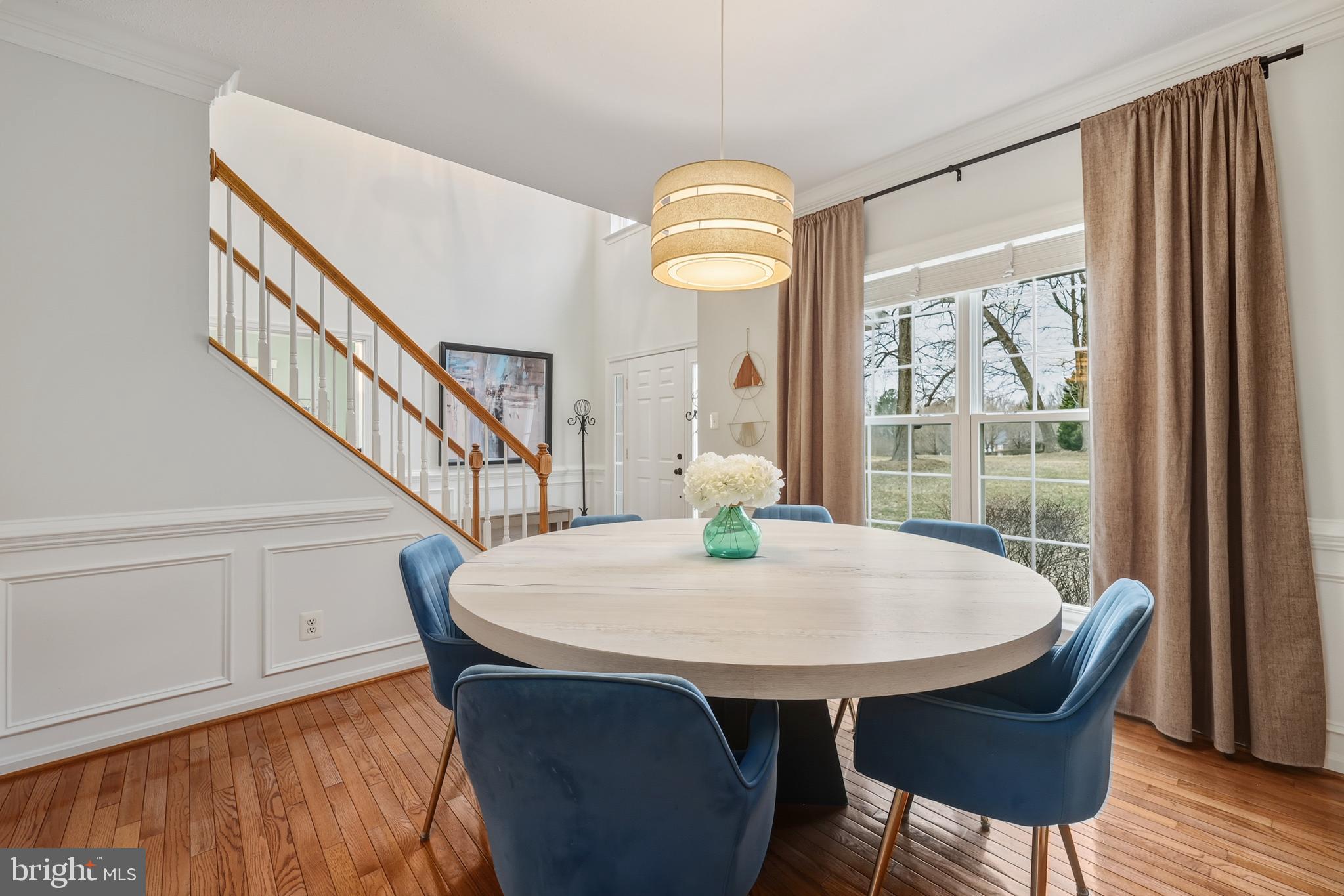 8439 Den Circle King George, VA 22485 - Photo 13 of 53 a view of a dining room with furniture window and wooden floor