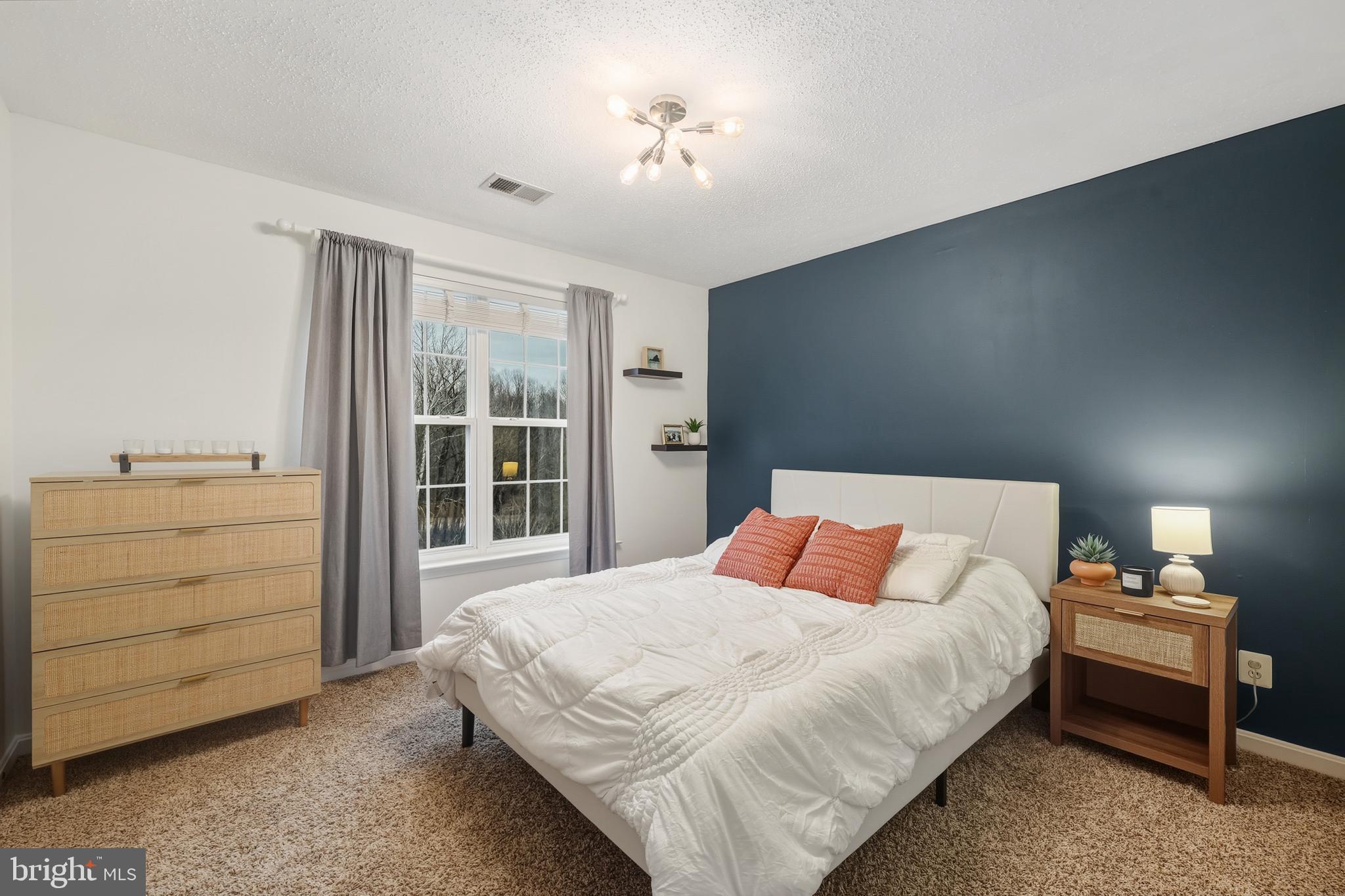 8439 Den Circle King George, VA 22485 - Photo 26 of 53 a bedroom with a bed and a dresser