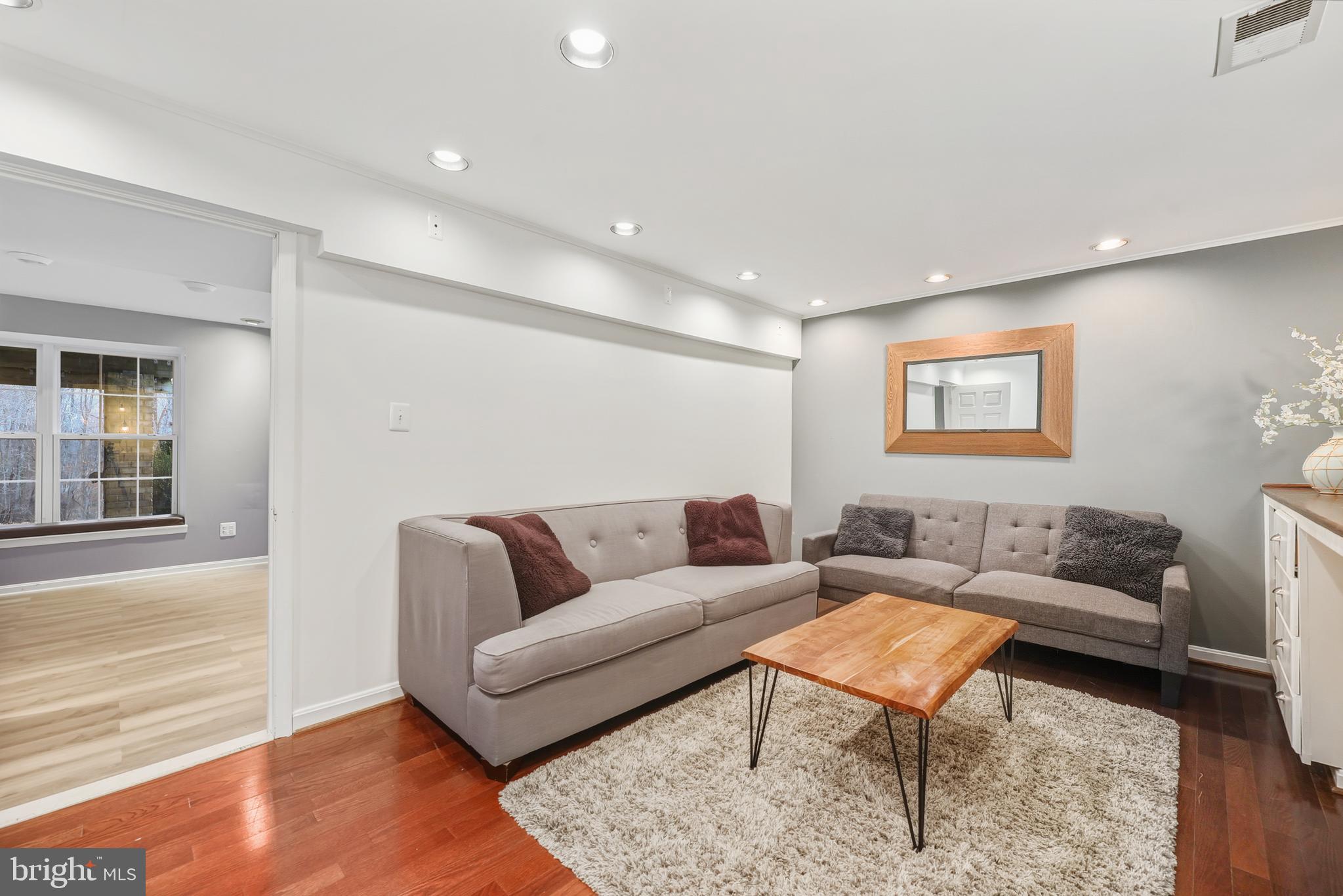 8439 Den Circle King George, VA 22485 - Photo 31 of 53 a living room with furniture and a wooden floor