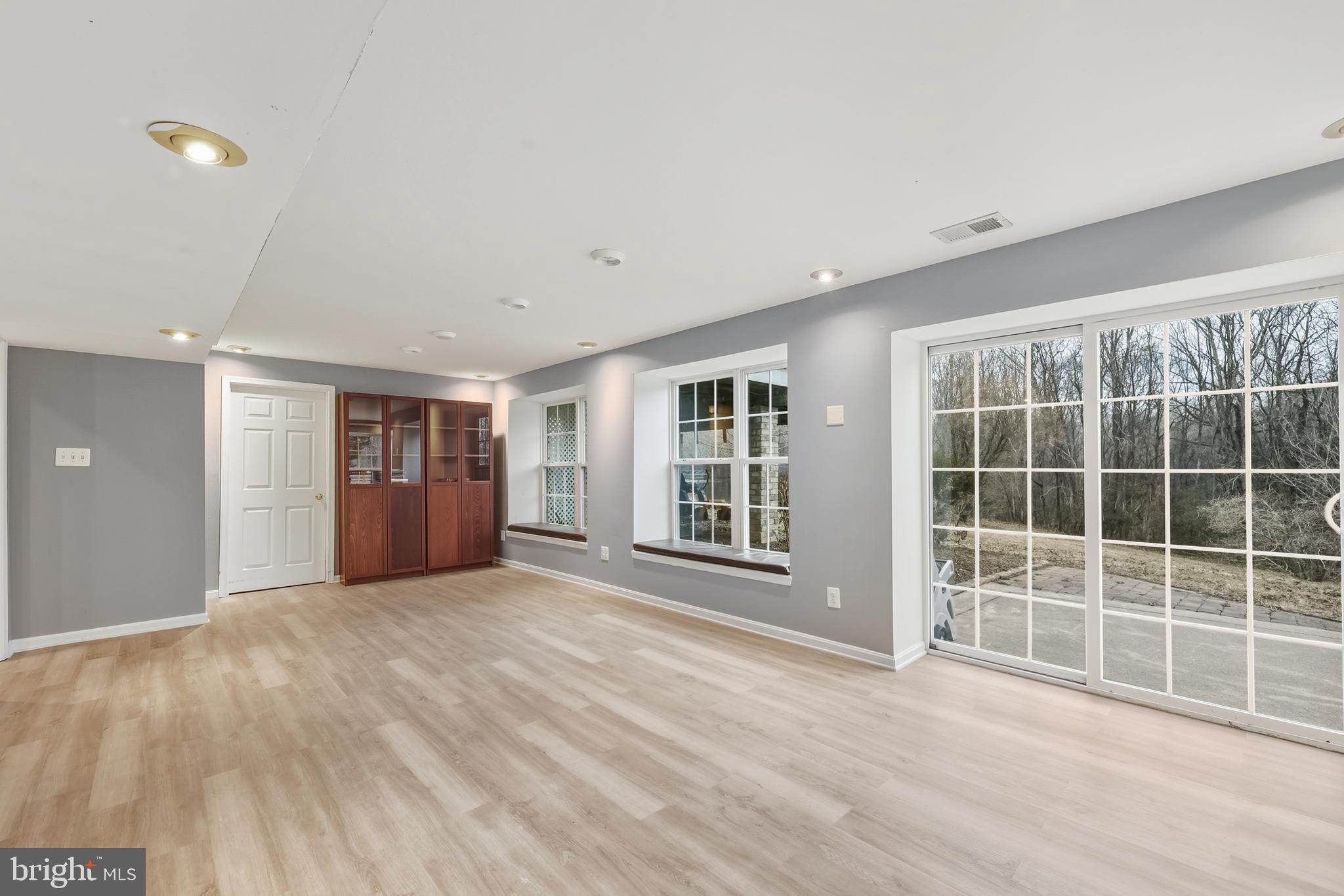 8439 Den Circle King George, VA 22485 - Photo 33 of 53 a view of an empty room with a window and wooden floor