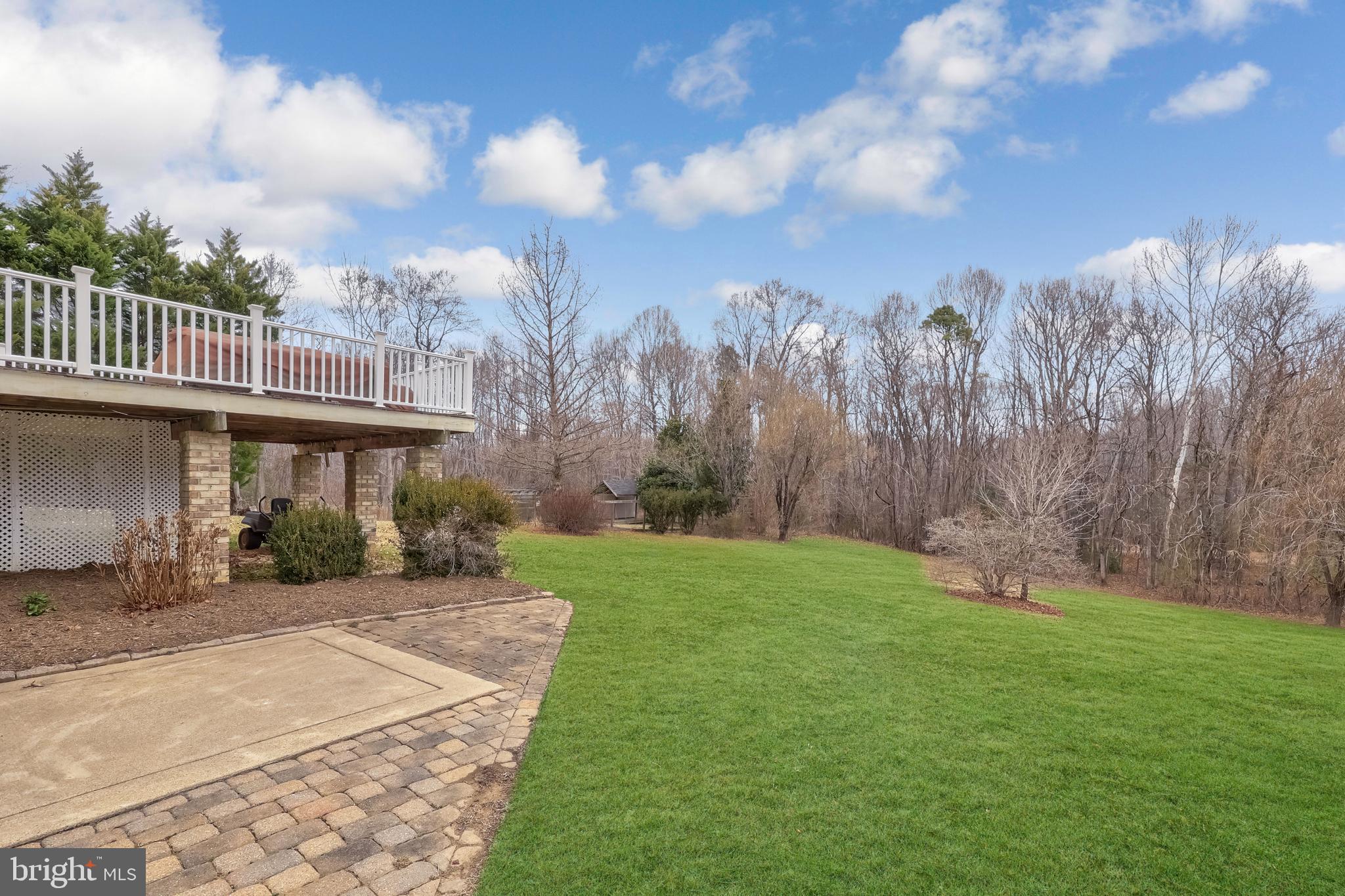 8439 Den Circle King George, VA 22485 - Photo 37 of 53 a backyard of a house with lots of green space table and chairs