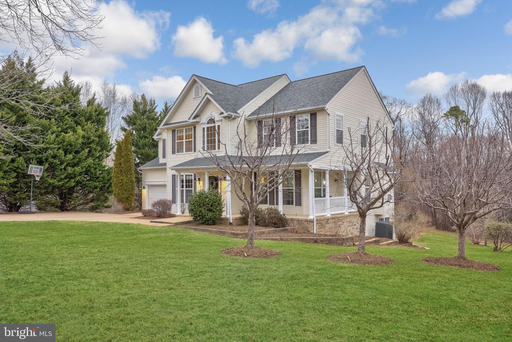 8439 Den Circle King George, VA 22485 - Photo 42 of 53 a front view of house with yard and green space