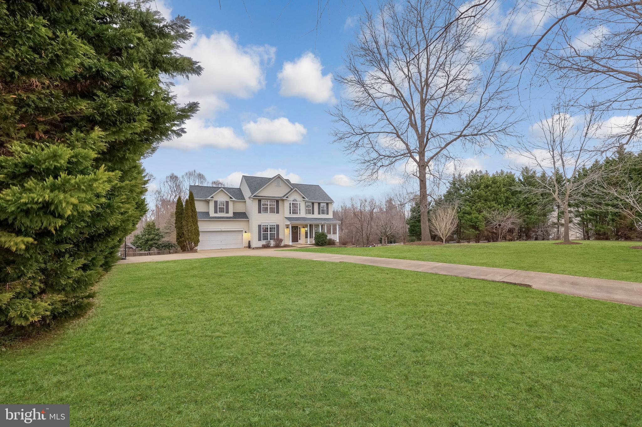 8439 Den Circle King George, VA 22485 - Photo 44 of 53 a view of a house with a big yard and large trees