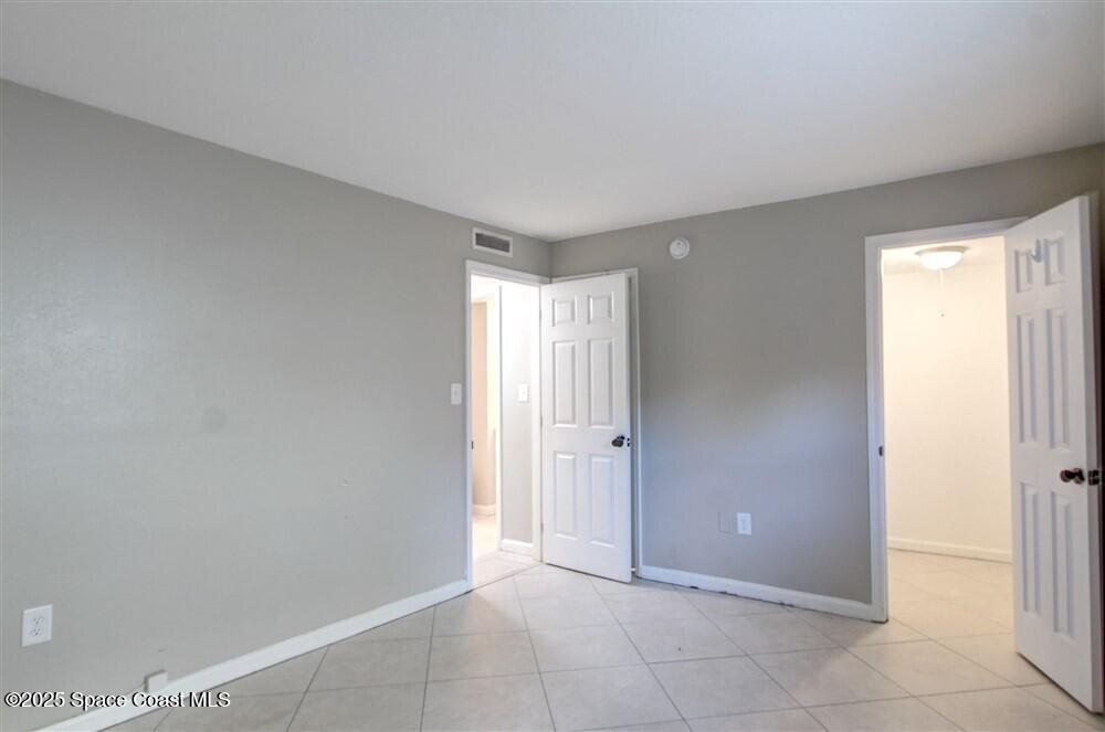 130 Roosevelt Avenue, Unit 104 Satellite Beach, FL 32937 - Photo 18 of 21 a view of an empty room