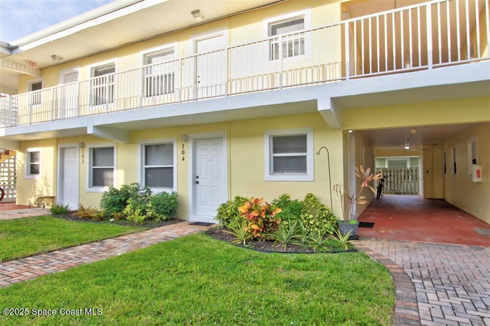 130 Roosevelt Avenue, Unit 104 Satellite Beach, FL 32937 - Photo 2 of 21 a view of a house with brick walls