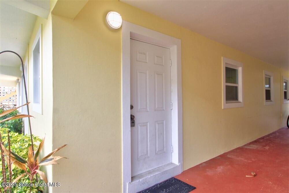 130 Roosevelt Avenue, Unit 104 Satellite Beach, FL 32937 - Photo 3 of 21 a view of a room with windows