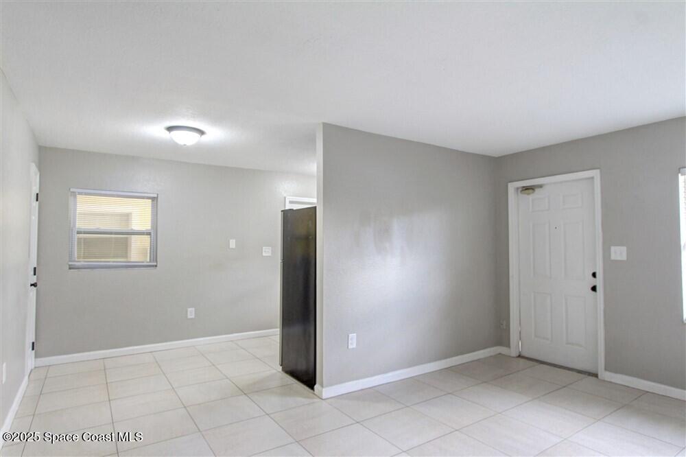 130 Roosevelt Avenue, Unit 104 Satellite Beach, FL 32937 - Photo 10 of 21 an empty room with a bathroom