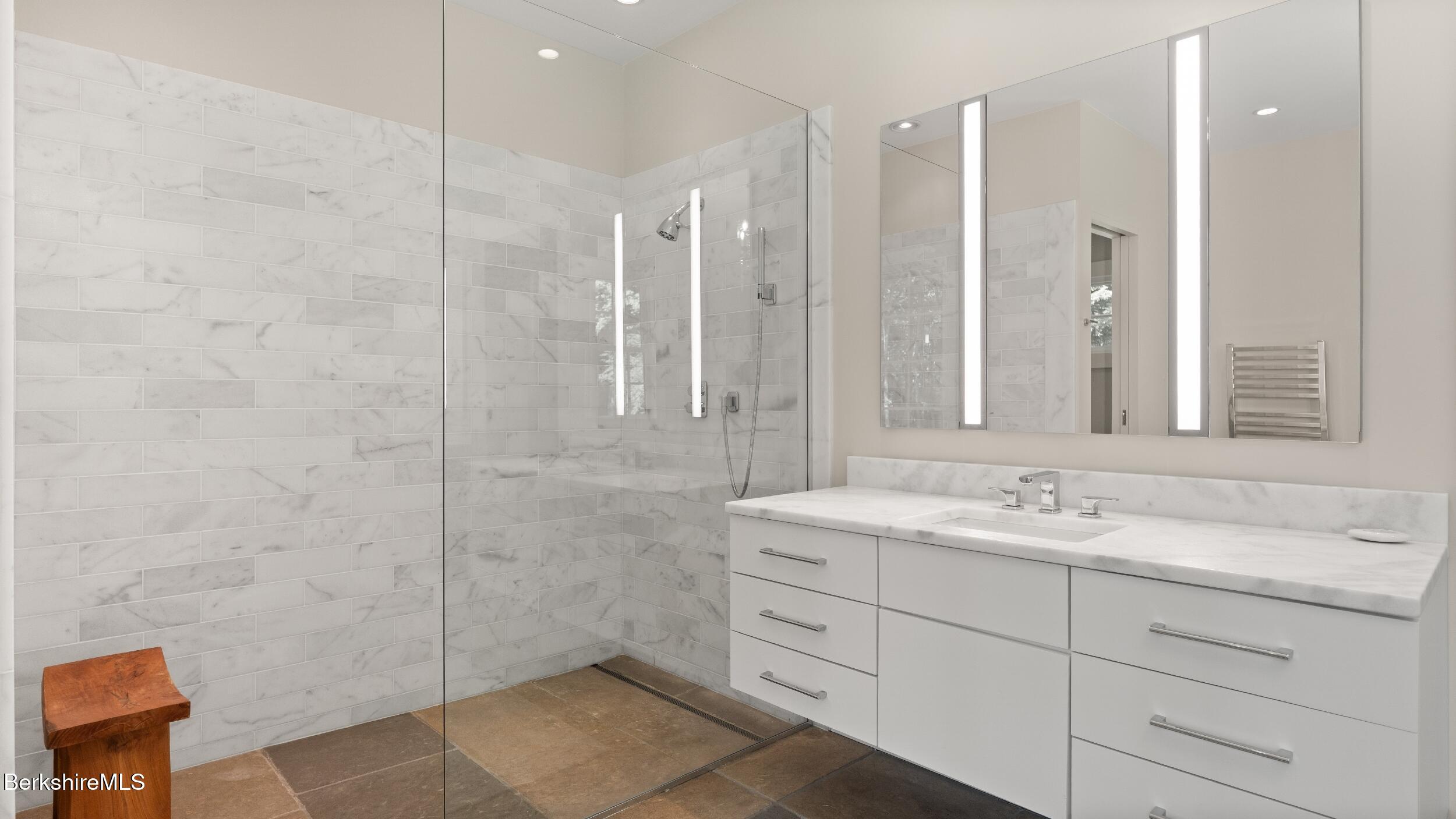 232 Giberson Road Sheffield, MA 01257 - Photo 18 of 53 a bathroom with a granite countertop sink mirror and double