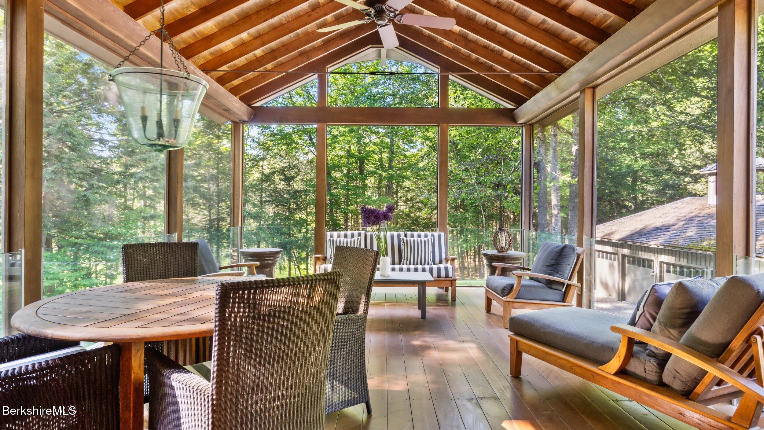 232 Giberson Road Sheffield, MA 01257 - Photo 29 of 53 a view of a patio with a table chairs and a table