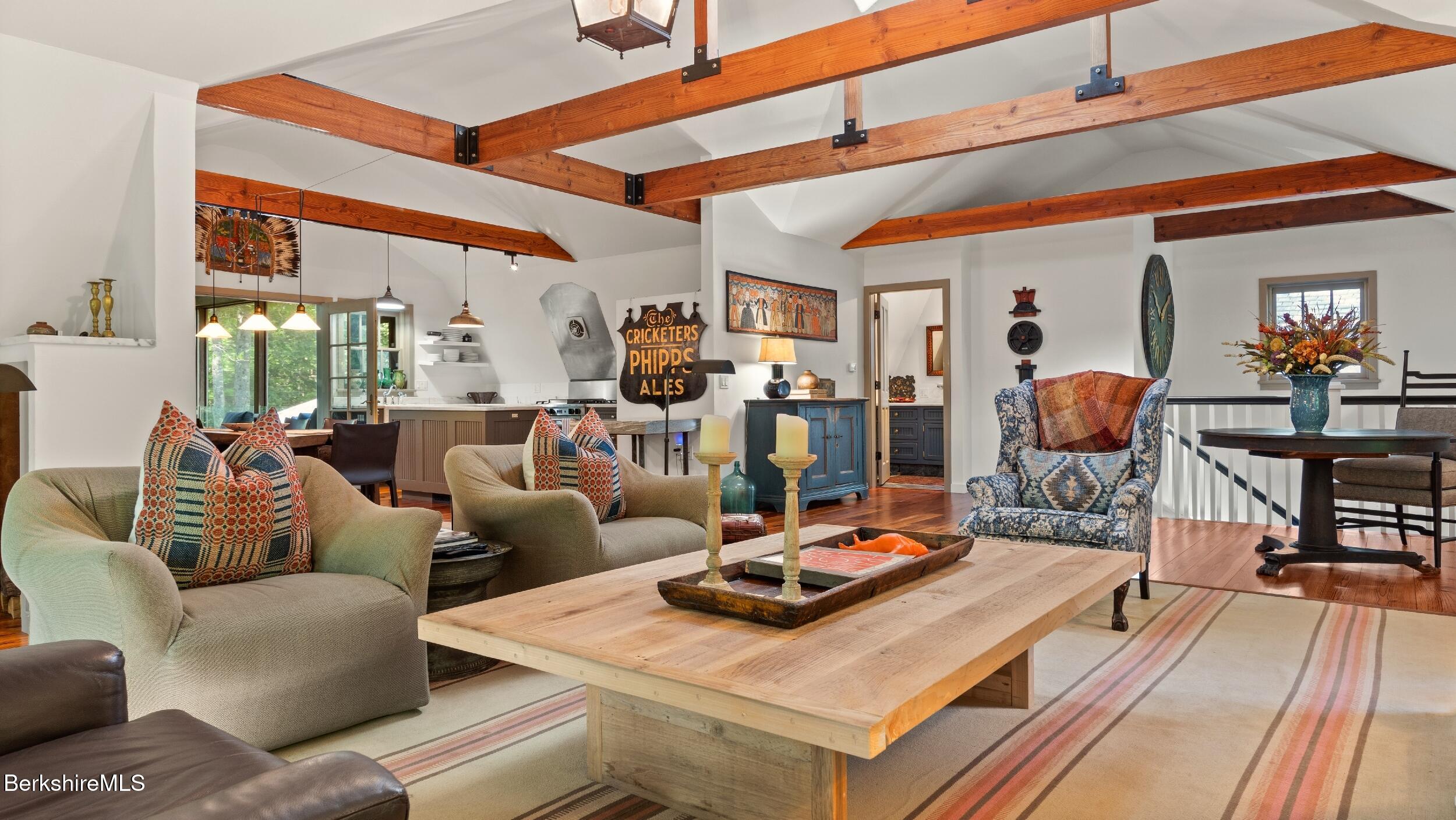 232 Giberson Road Sheffield, MA 01257 - Photo 33 of 53 a living room with furniture a flat screen tv and kitchen view