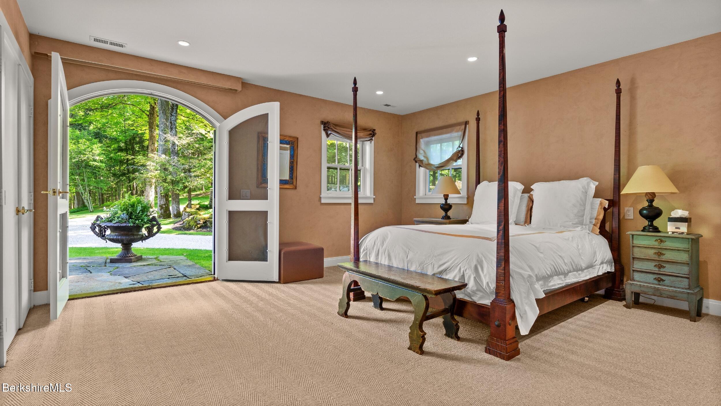 232 Giberson Road Sheffield, MA 01257 - Photo 36 of 53 a bed room with a bed and a large window