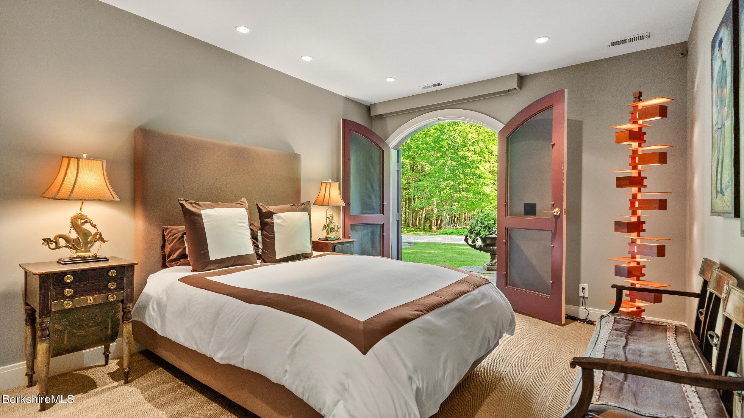 232 Giberson Road Sheffield, MA 01257 - Photo 38 of 53 a bedroom with a bed and wooden floor