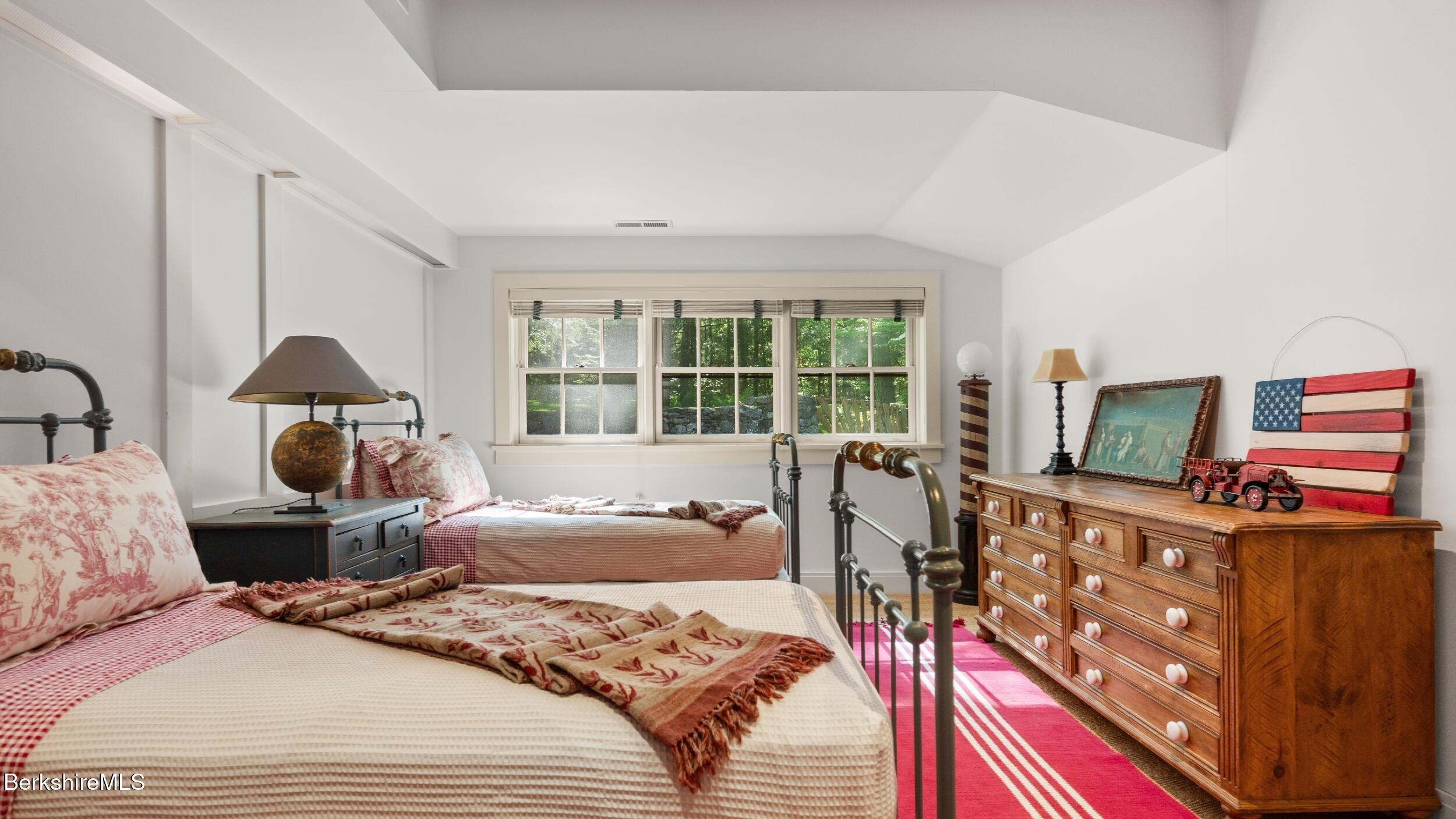 232 Giberson Road Sheffield, MA 01257 - Photo 39 of 53 a bedroom with two beds and a large window