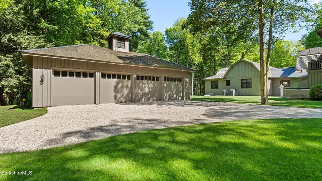 a view of a house with a yard and plants