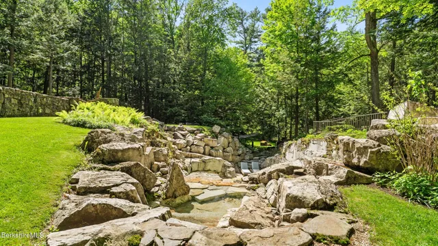 a backyard of a house with lots of green space