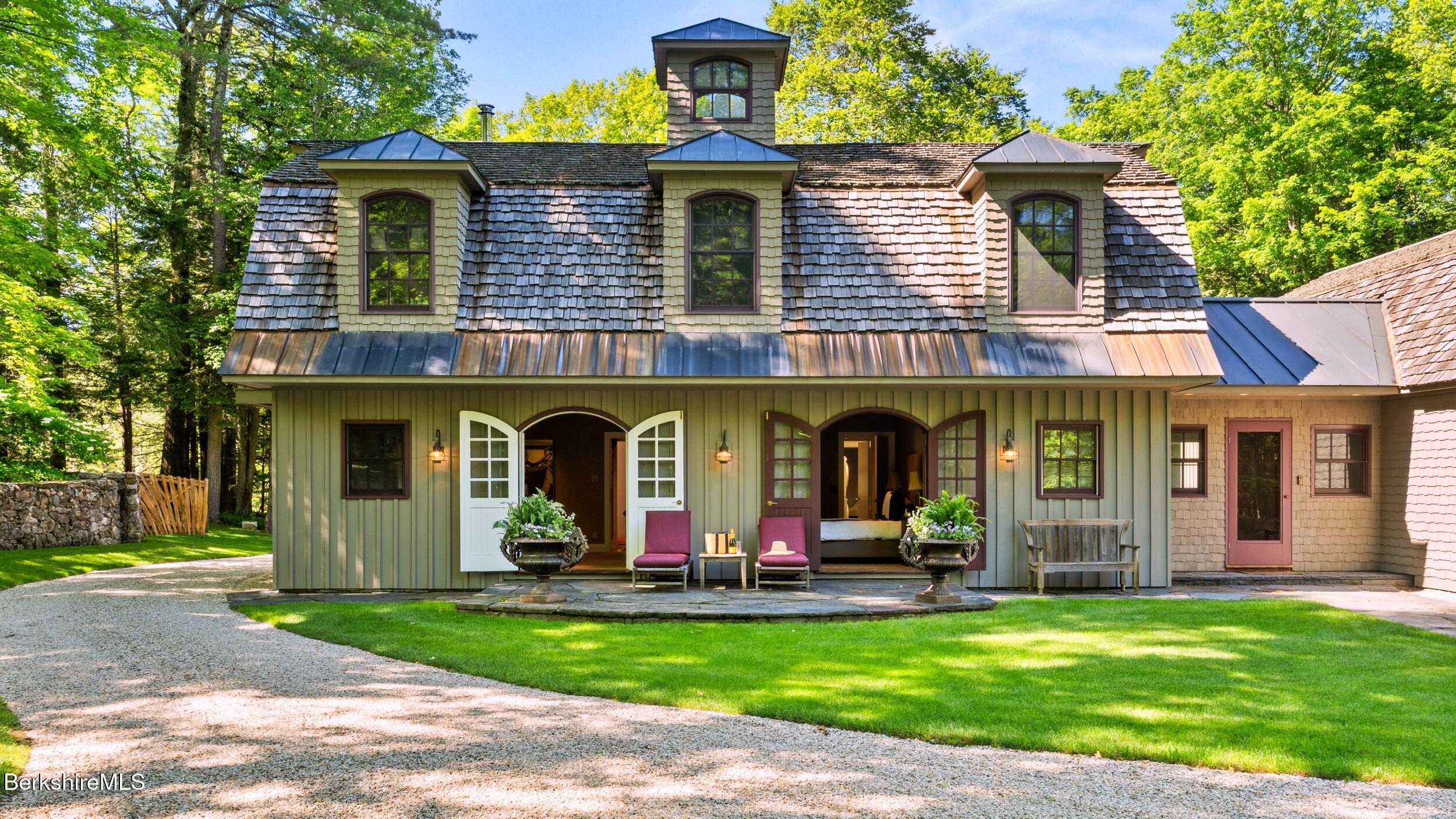 232 Giberson Road Sheffield, MA 01257 - Photo 9 of 53 a group of people sitting in front of a house