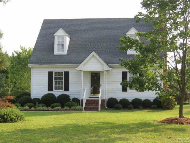 8216 Kennebec Road Willow Spring, NC 27592 - Photo 1 of 1 a front view of a house with a yard