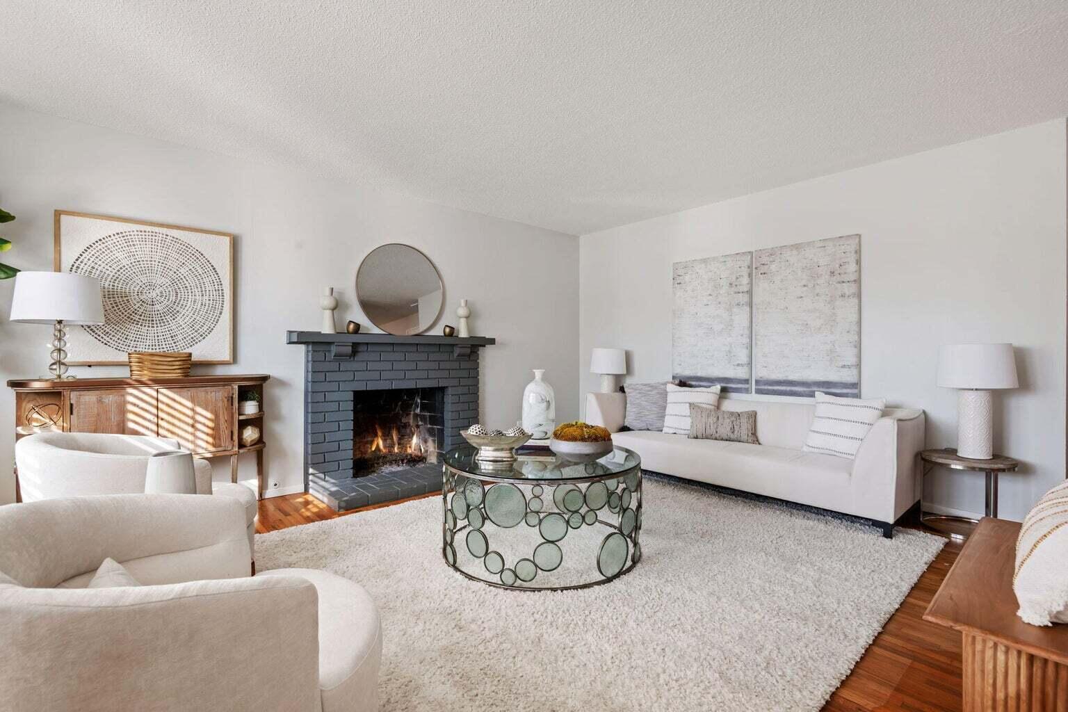 52 Deerhurst Drive Santa Barbara, CA 93117 - Photo 2 of 13 a living room with furniture a fireplace and a table