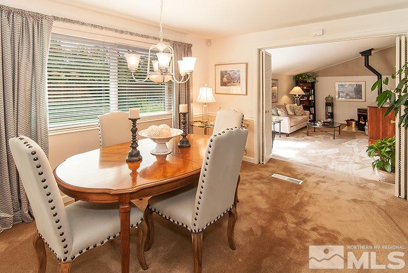 2520 Trentham Way Reno, NV 89509 - Photo 6 of 16 a view of a dining room with furniture and chandelier