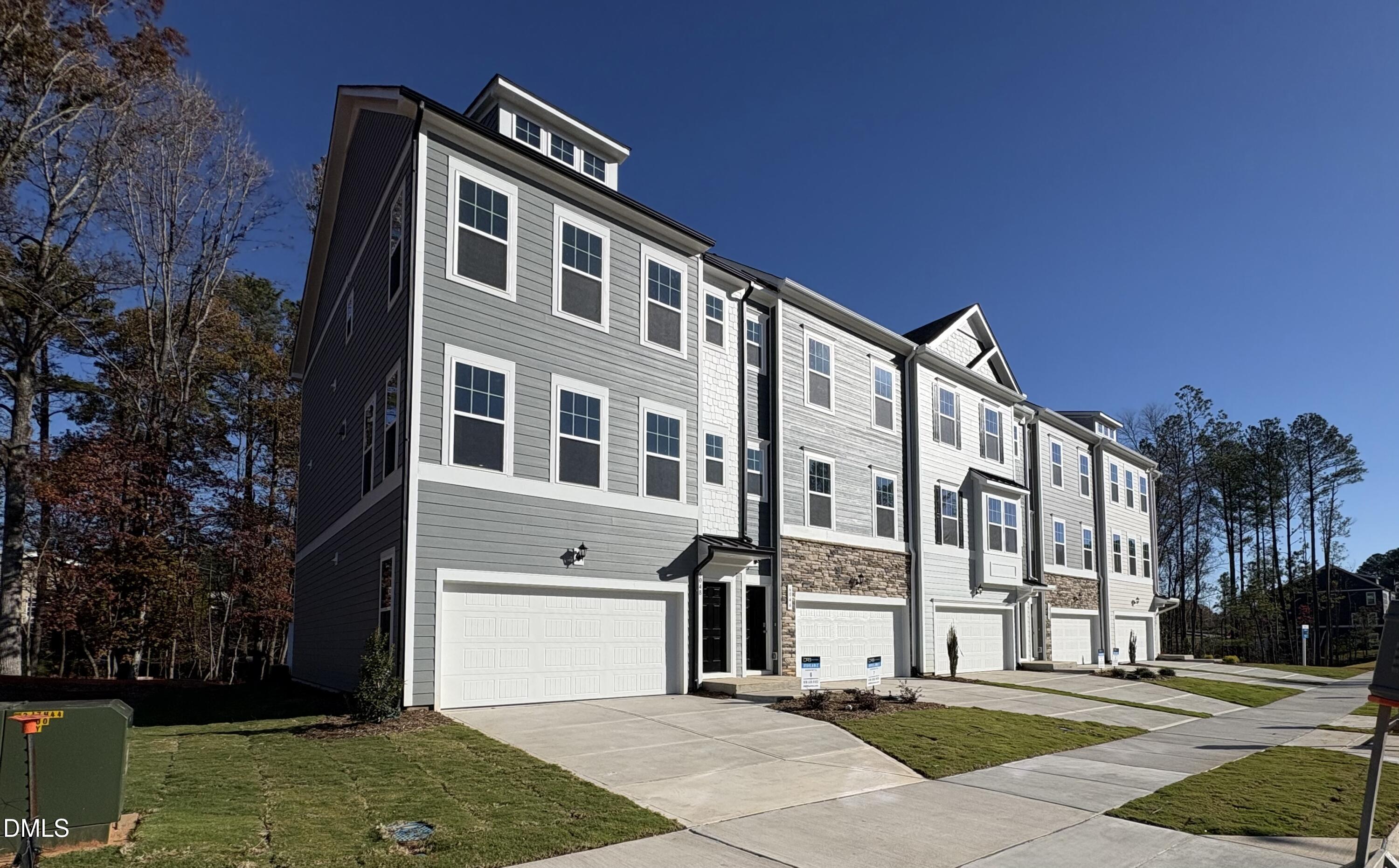 a front view of a building with a yard