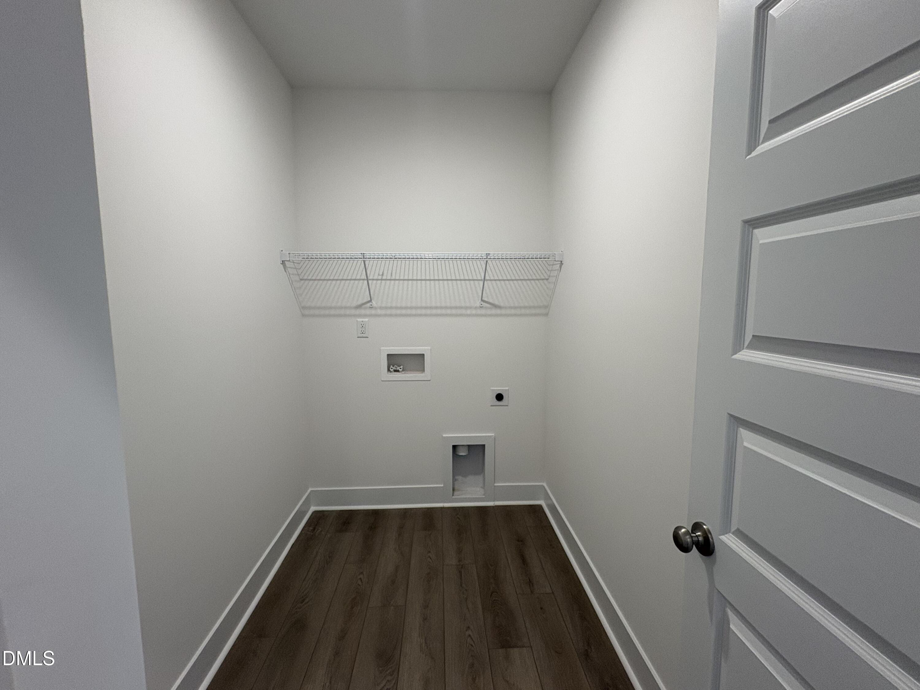 6046 Dunzo Drive Raleigh, NC 27617 - Photo 15 of 44 a view of small space with racks on the wall