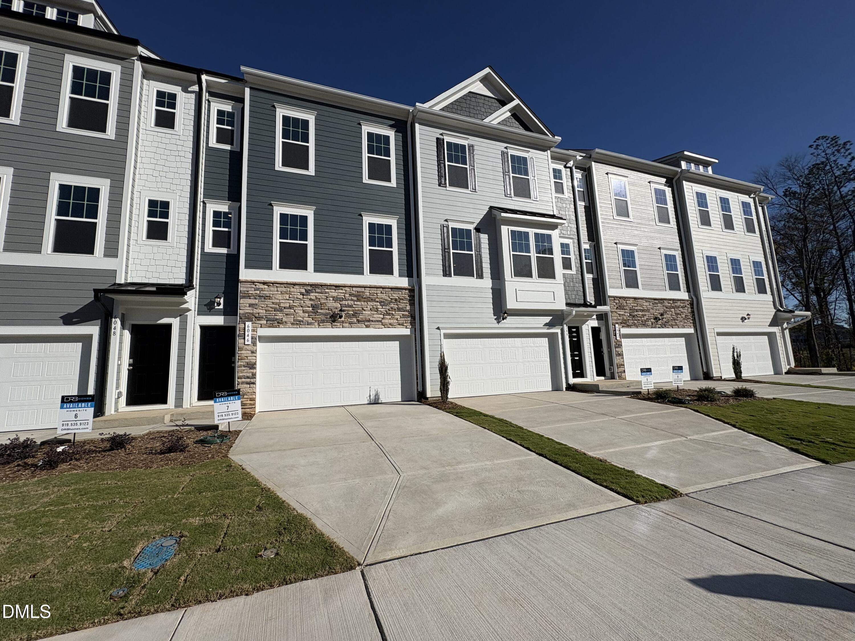 6046 Dunzo Drive Raleigh, NC 27617 - Photo 2 of 44 a front view of residential houses with yard