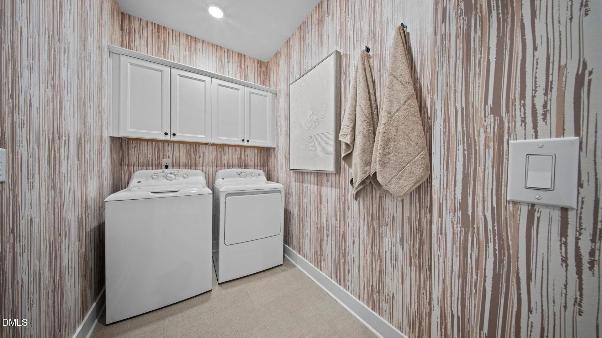 6046 Dunzo Drive Raleigh, NC 27617 - Photo 34 of 44 a utility room with dryer and washer