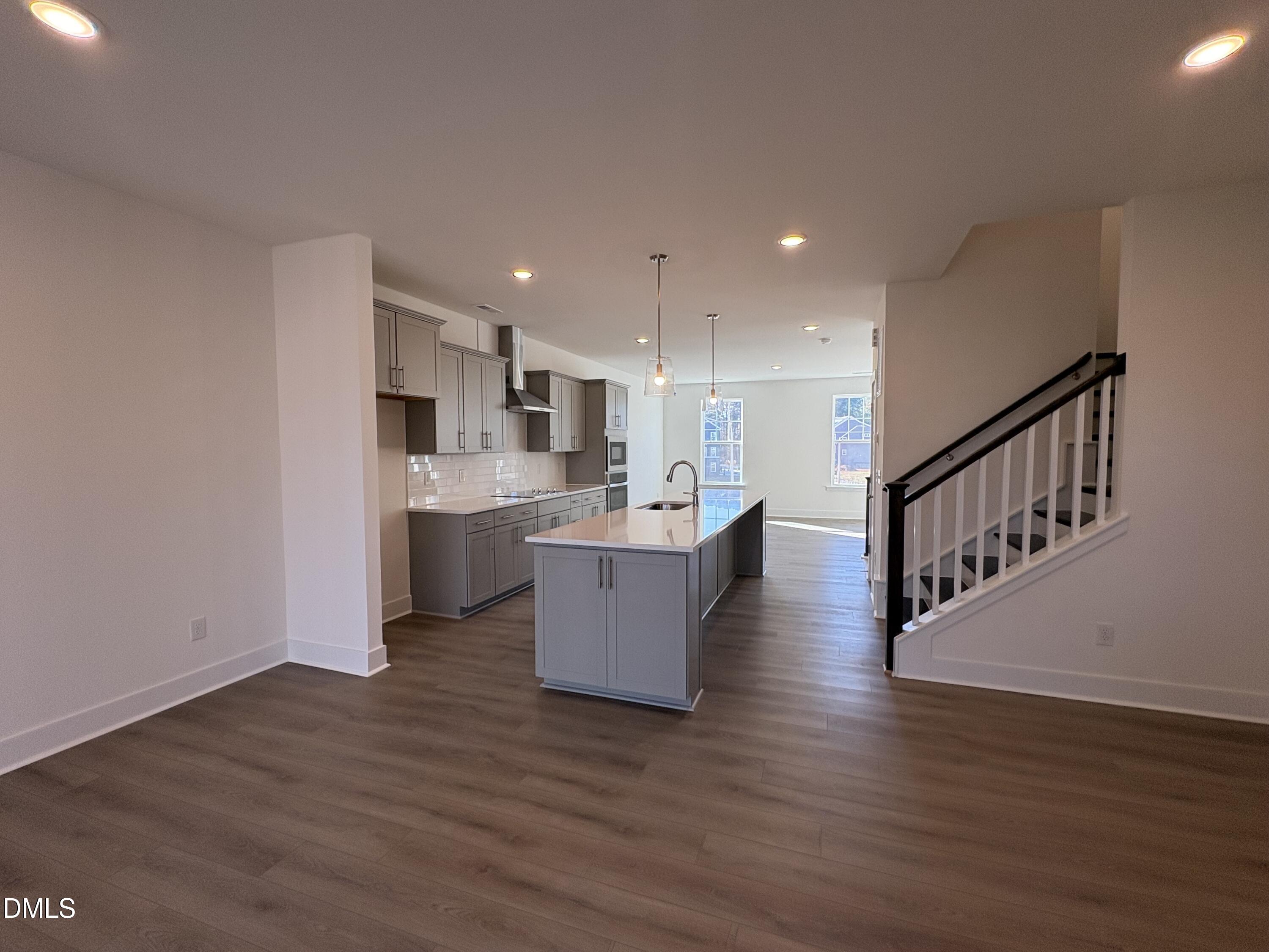 6046 Dunzo Drive Raleigh, NC 27617 - Photo 8 of 44 a view of kitchen with wooden floor and electronic appliances