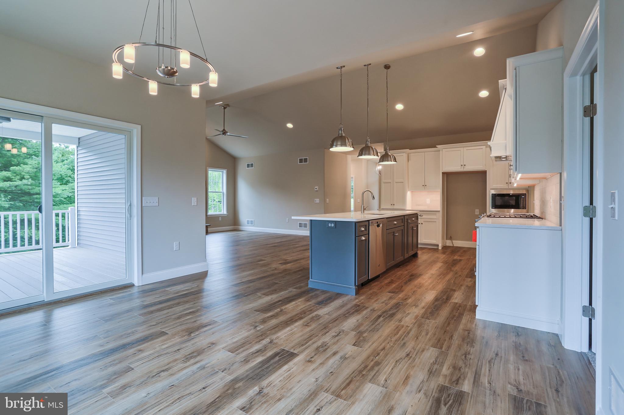 111 Starlight Lane Lebanon, PA 17046 - Photo 21 of 30 a large kitchen with stainless steel appliances kitchen island a large counter top and a wooden floors