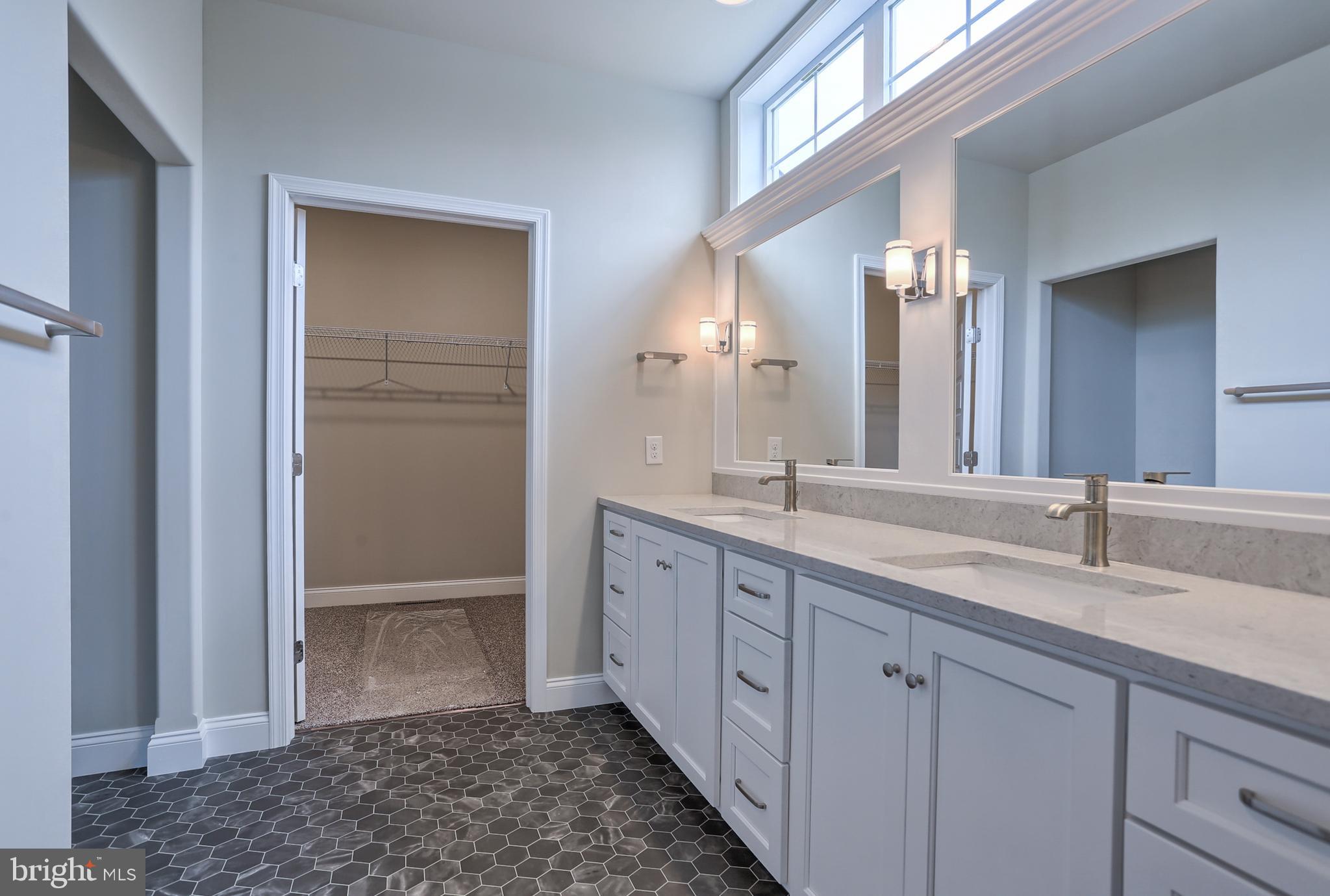 111 Starlight Lane Lebanon, PA 17046 - Photo 26 of 30 a spacious bathroom with a double vanity sink and a mirror