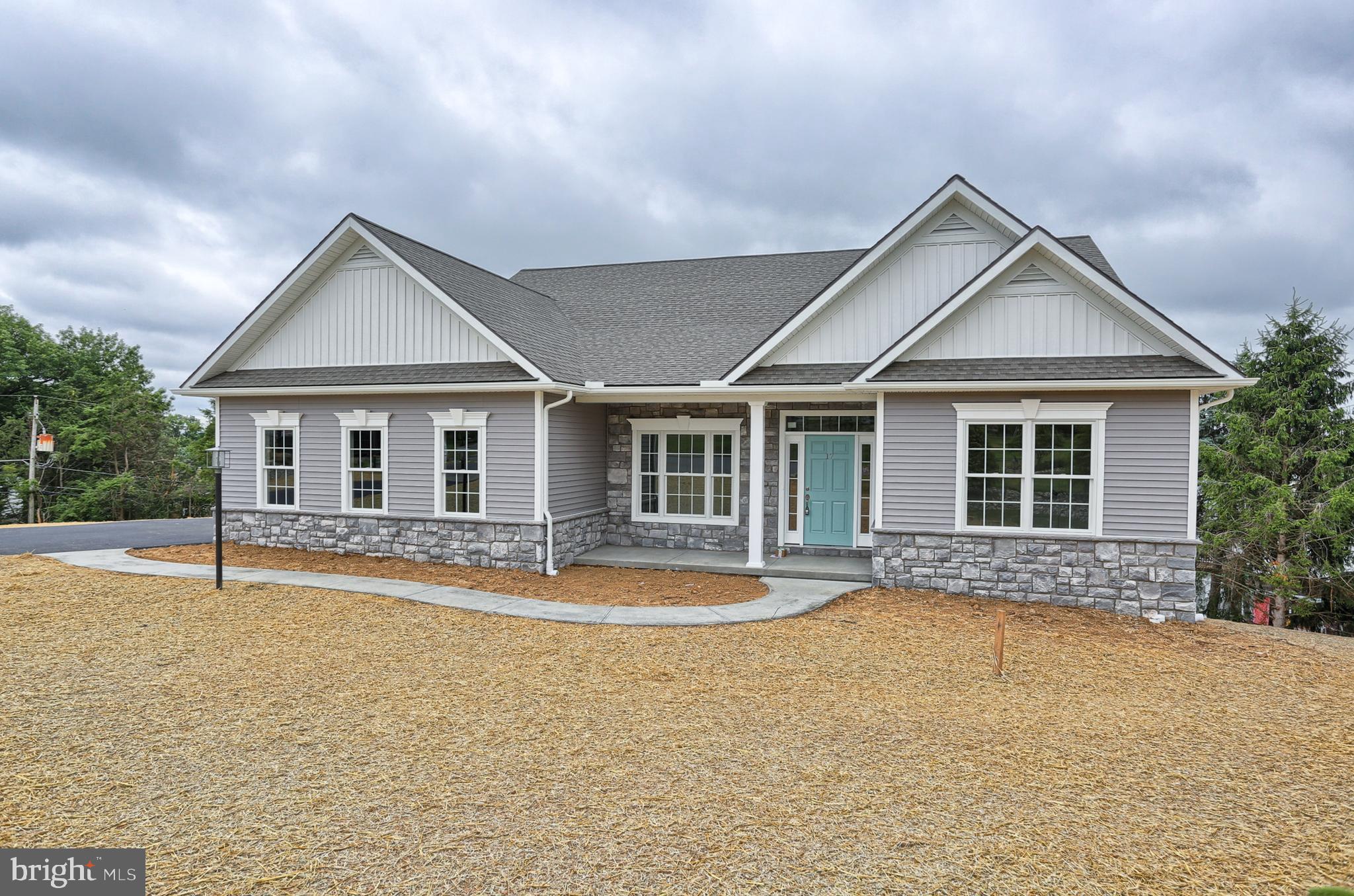 111 Starlight Lane Lebanon, PA 17046 - Photo 4 of 30 a front view of a house with a yard and outdoor seating