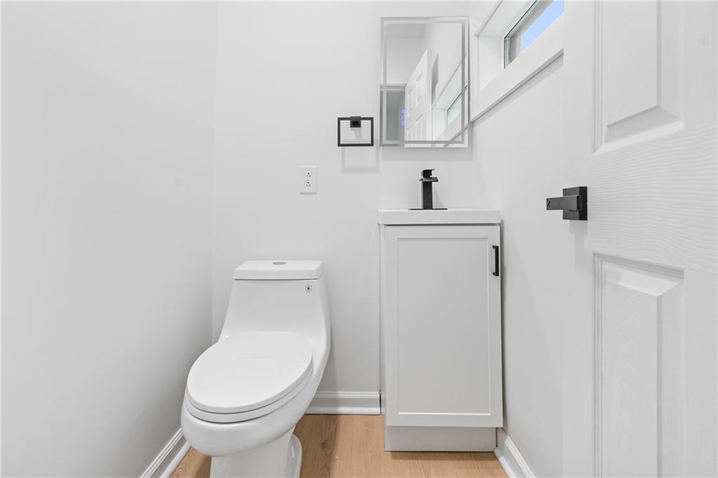 67 Ruth Street Pittsburgh, PA 15211 - Photo 11 of 26 a white toilet sitting next to a bathroom sink