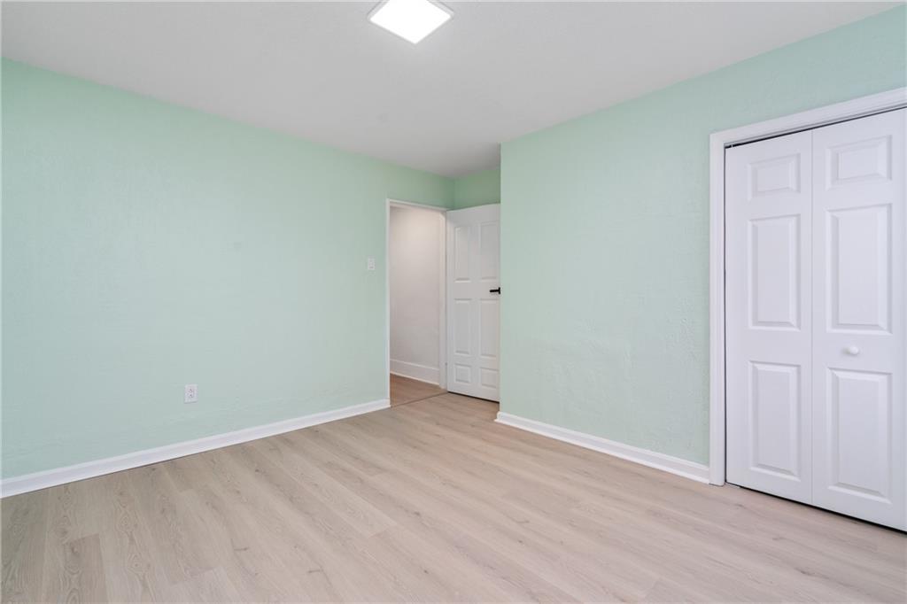 67 Ruth Street Pittsburgh, PA 15211 - Photo 16 of 26 an empty room with wooden floor